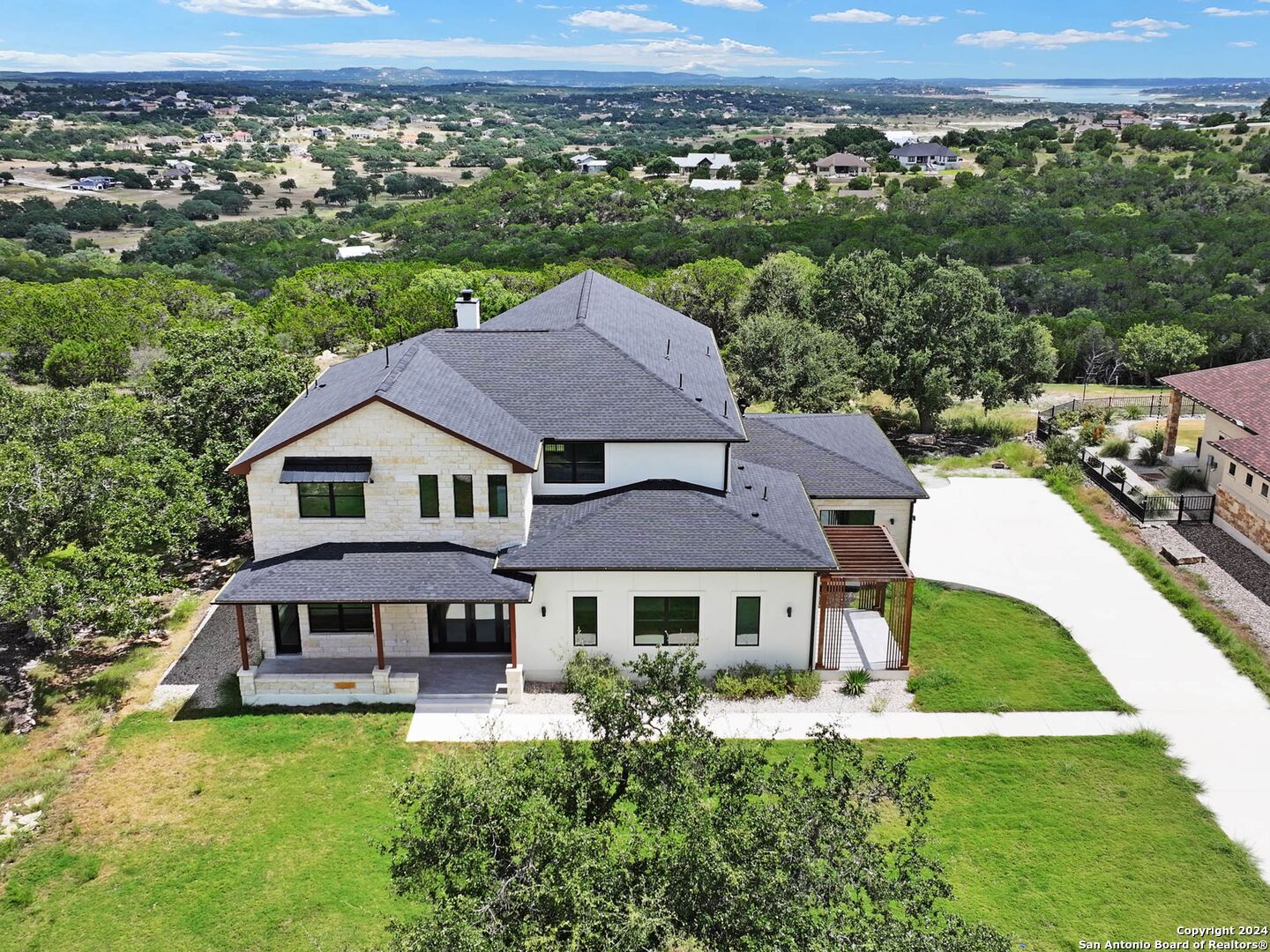 an aerial view of a house with swimming pool