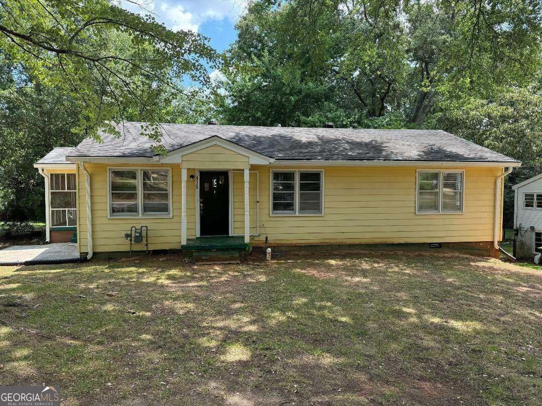 a house with trees in the background