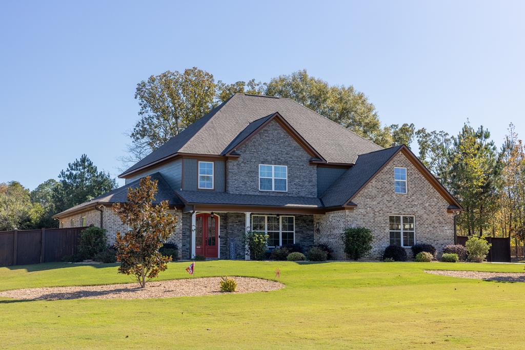 a front view of a house with a yard