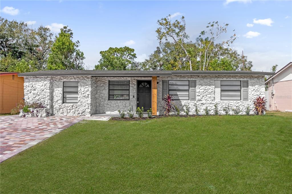 a front view of a house with garden