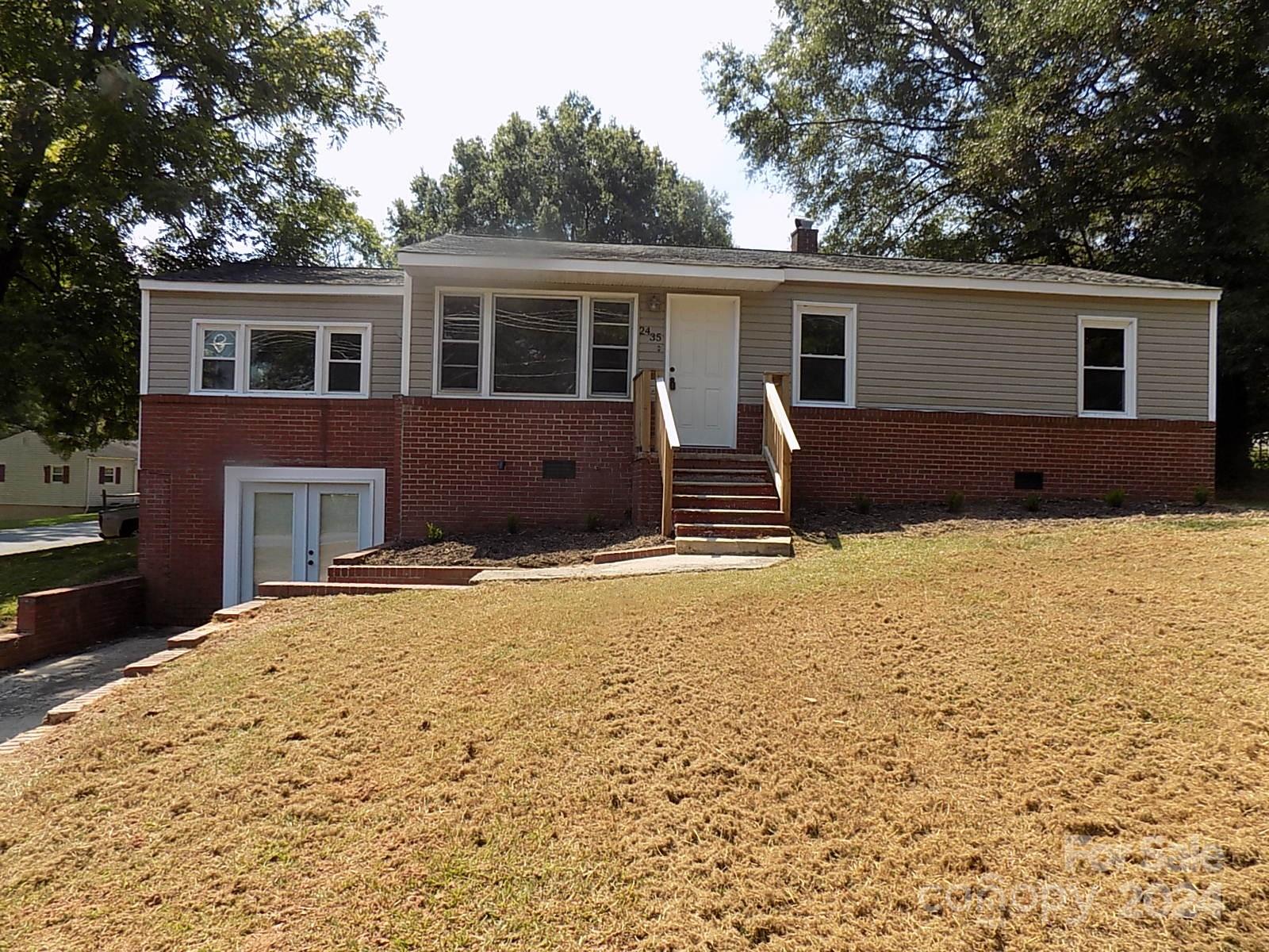 front view of a house with a yard