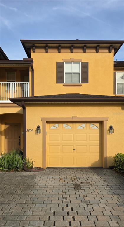 a front view of a house with a garage