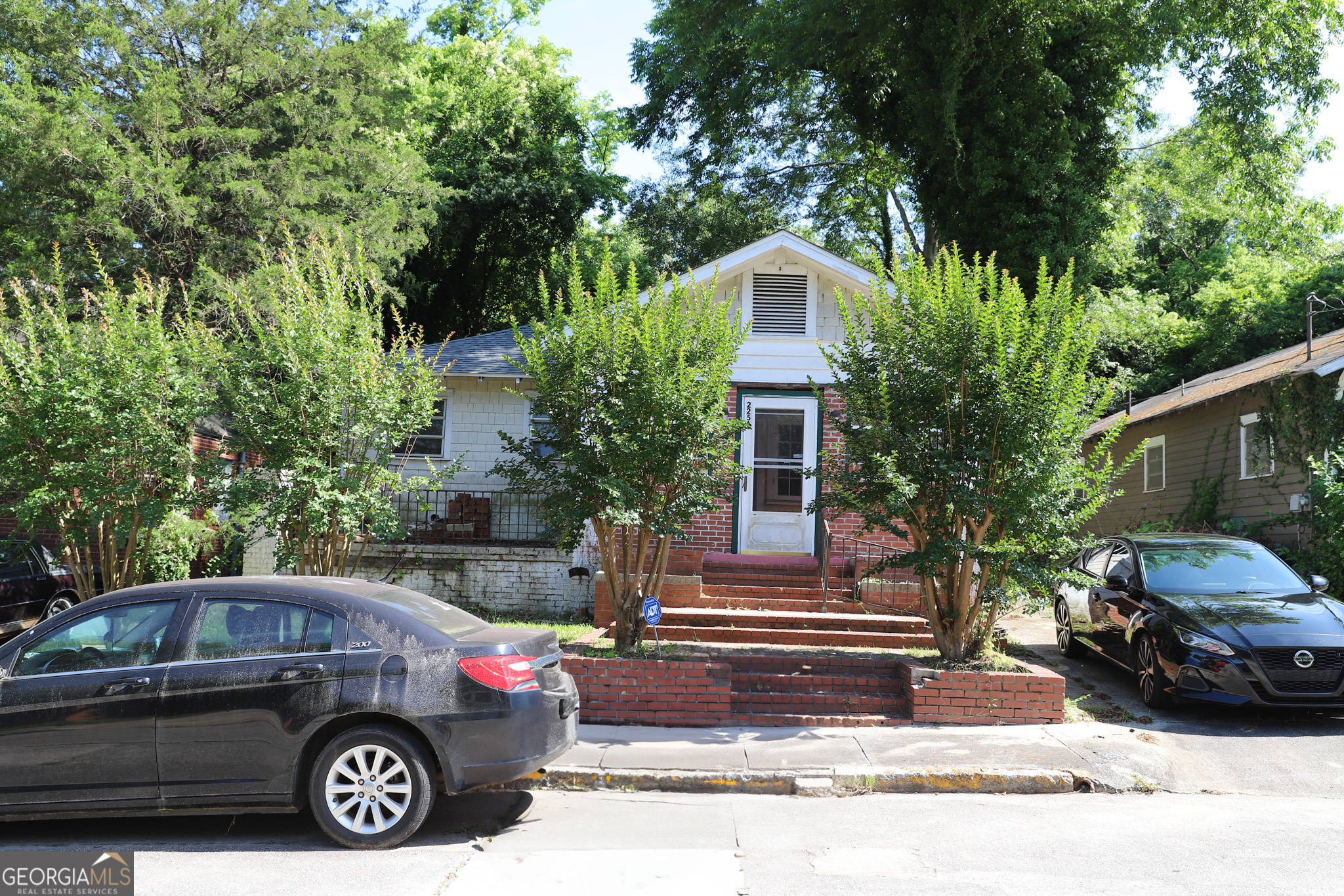 a view of a car parked in front of a house