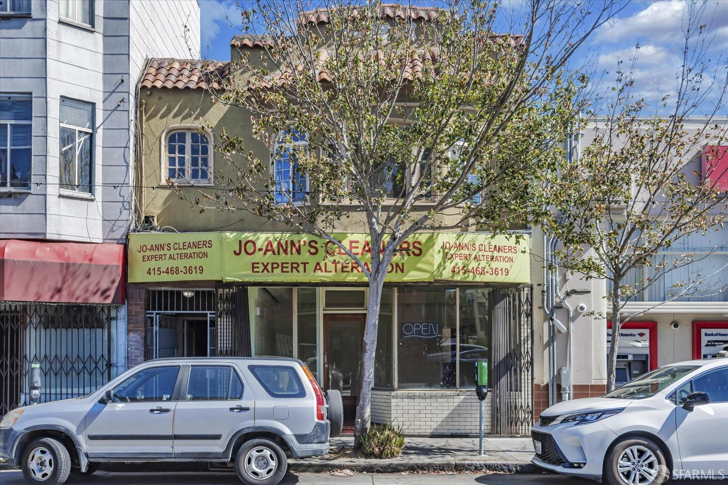 a front view of a building with parking space