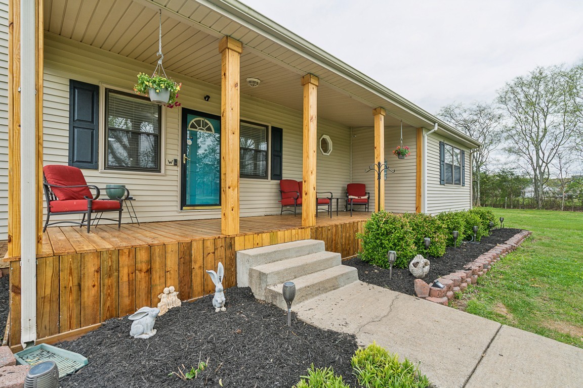 Country-like front porch on 5 acres, unique property that combines the peacefulness of the country with the convenience of town.  This home is one mile from Rockvale HS/Middle/Elm.  Eight minutes from Publix on New Salem and St. Andrews.