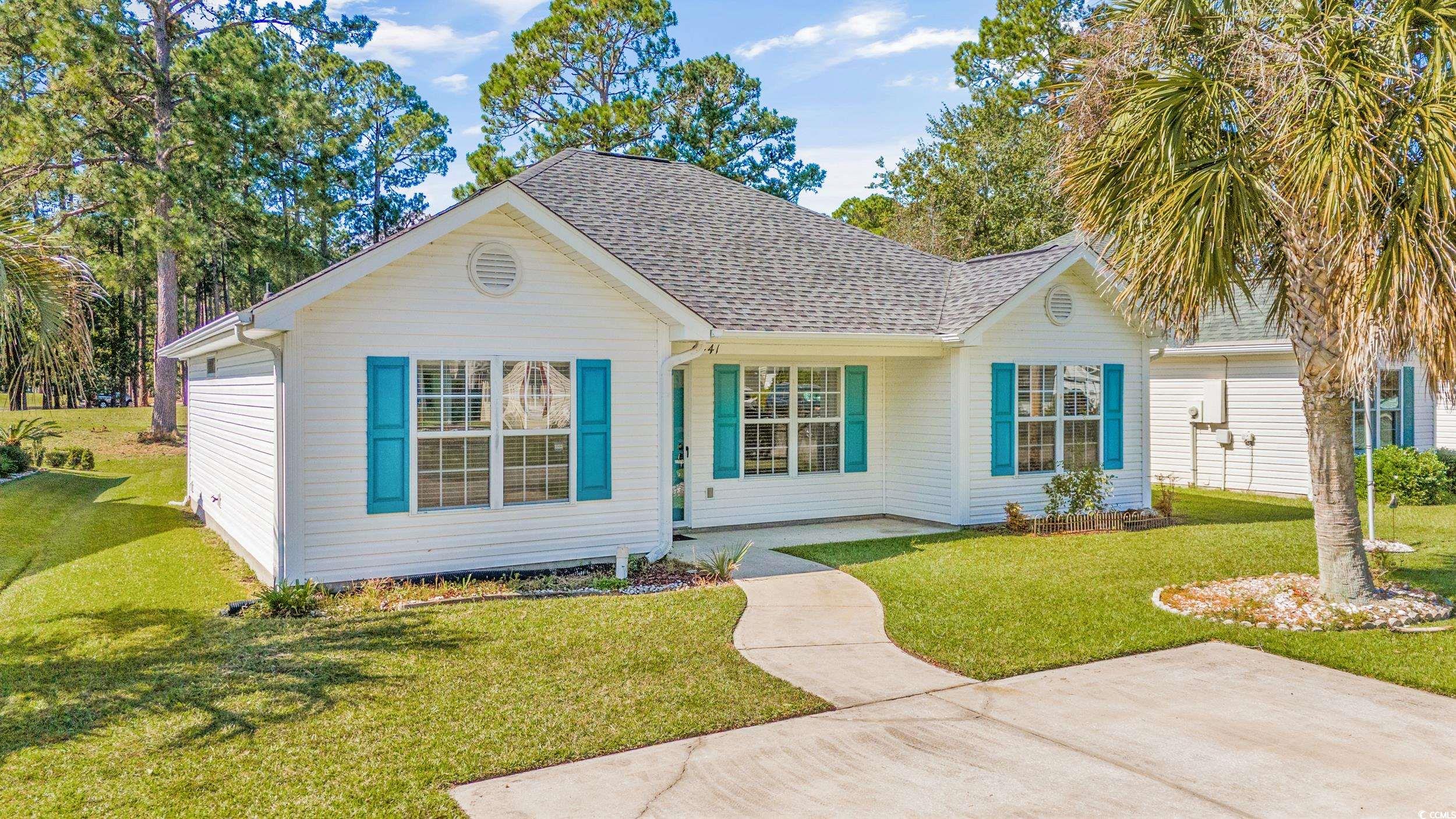 View of front of house with a front yard