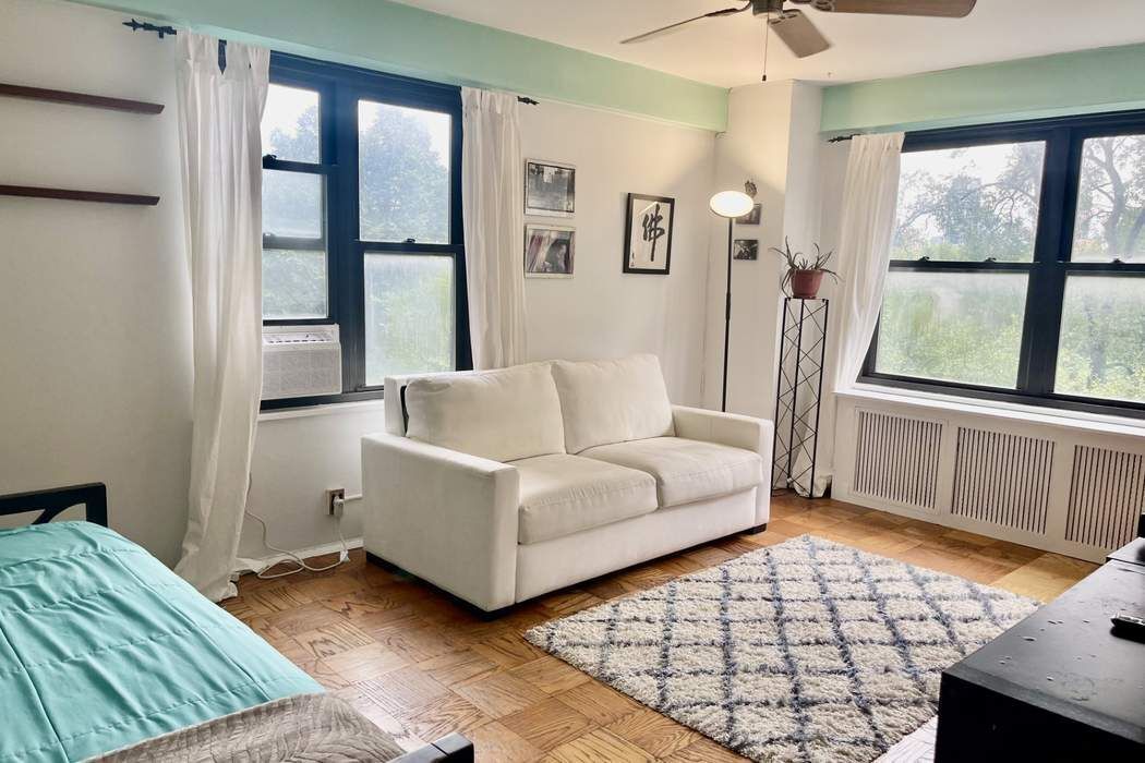 a living room with furniture and a window