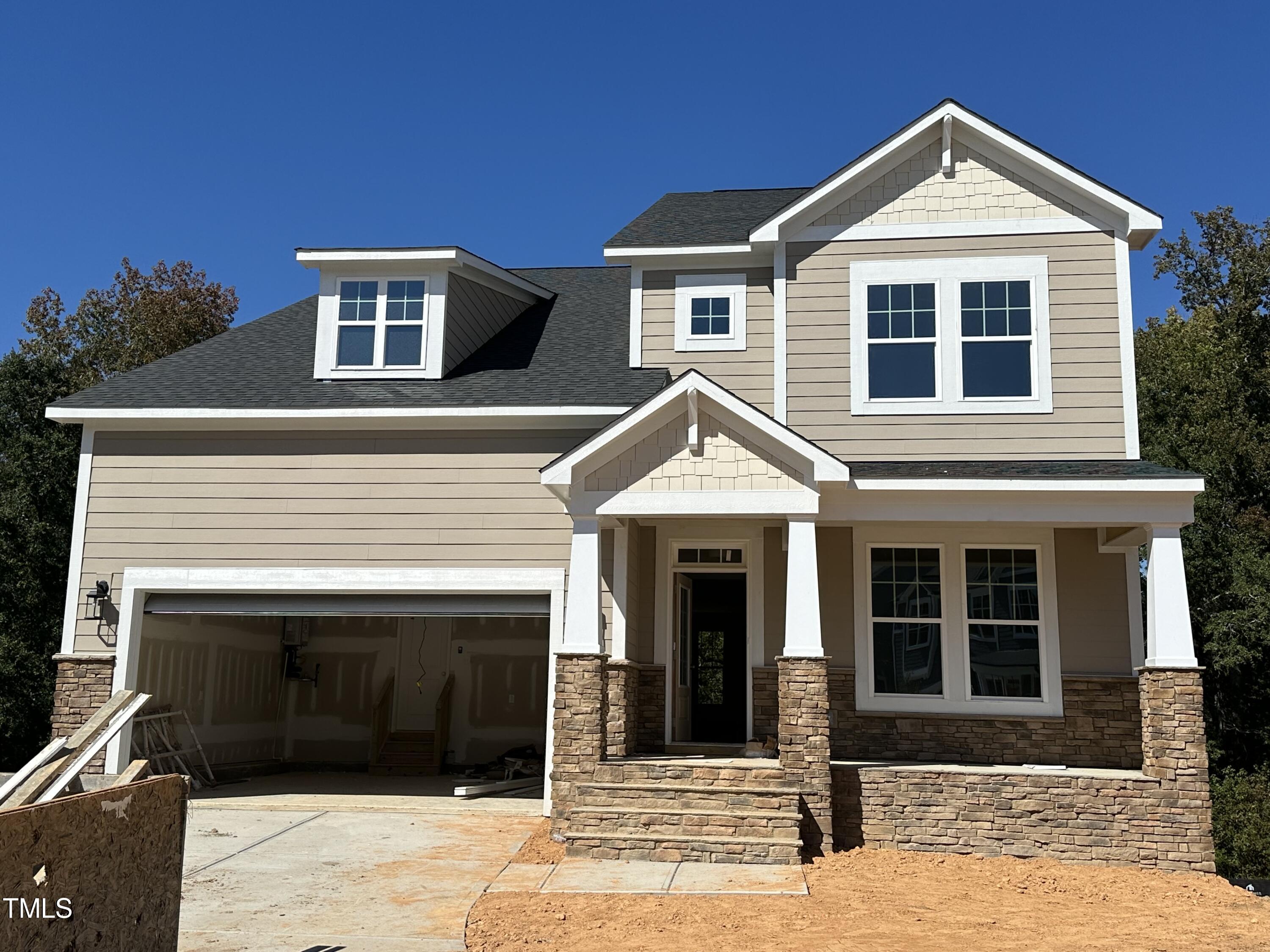 a front view of a house with yard