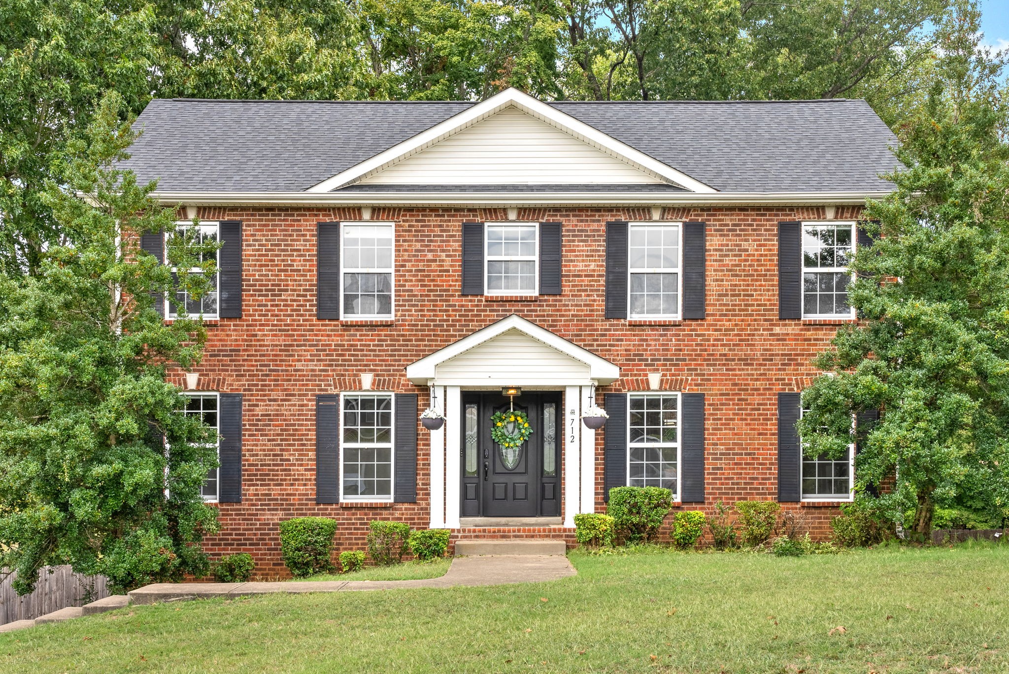 front view of a house with a yard