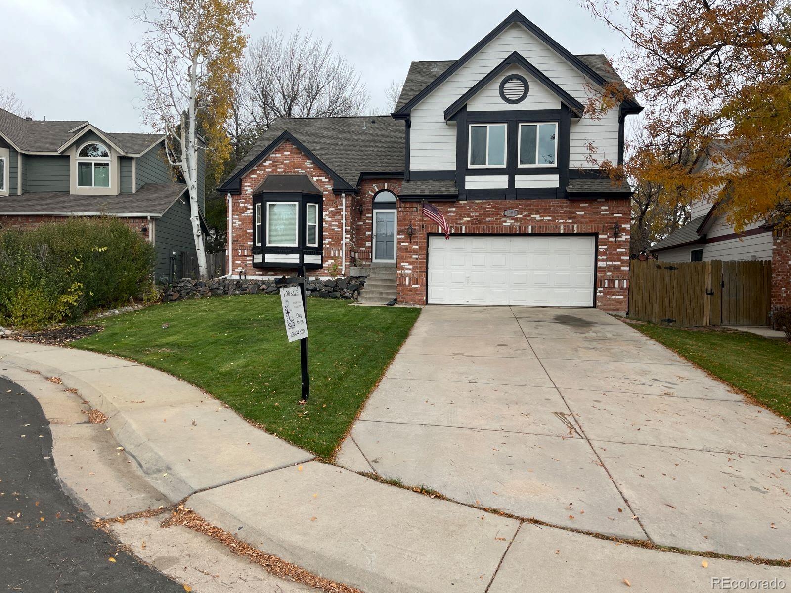 a front view of a house with yard