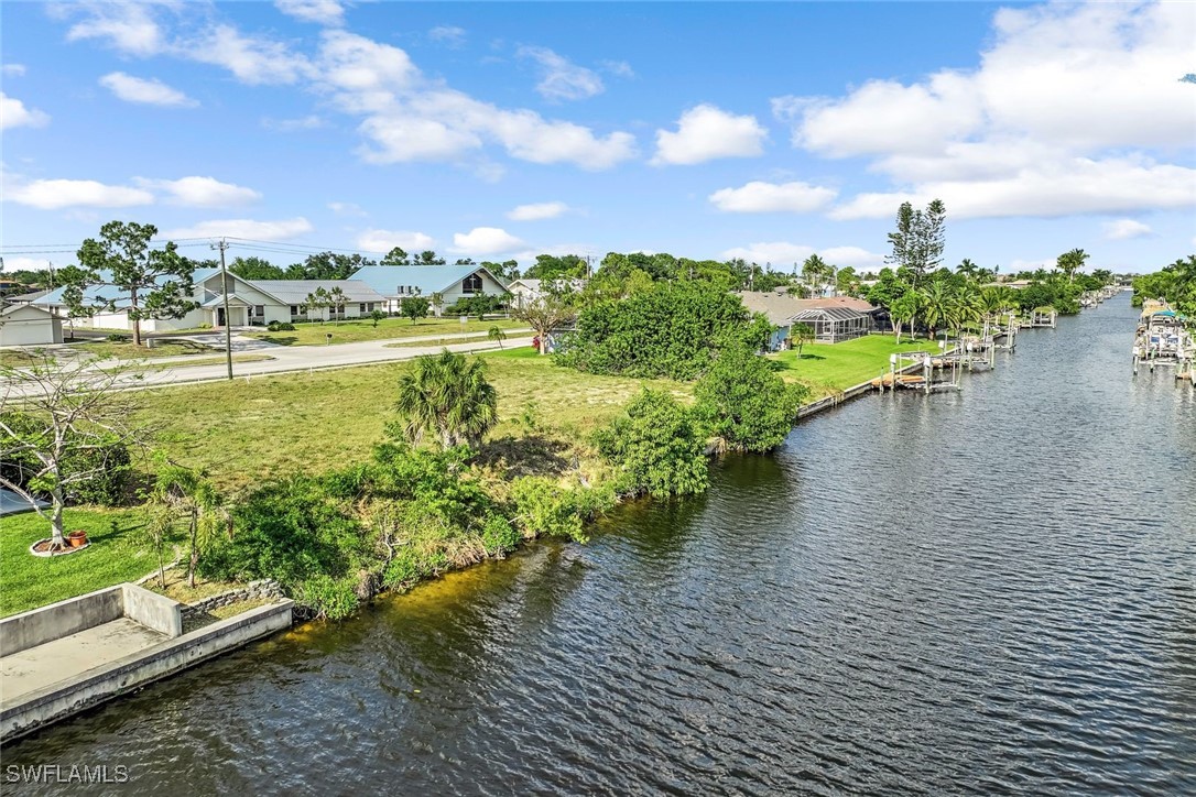 a view of a lake with houses in the back