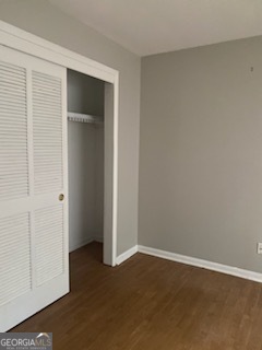 an empty room with closet area