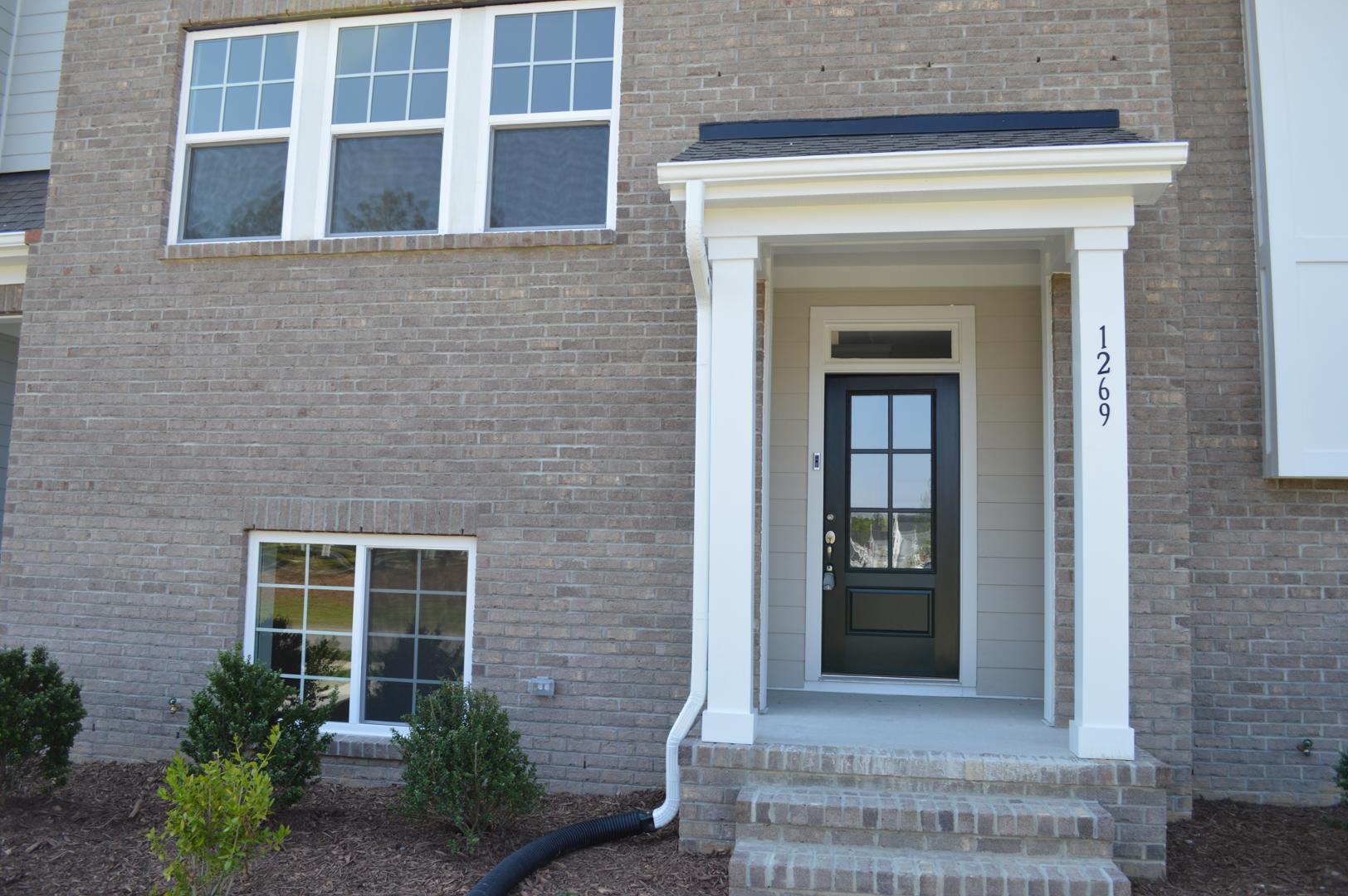 a front view of a house with a windows