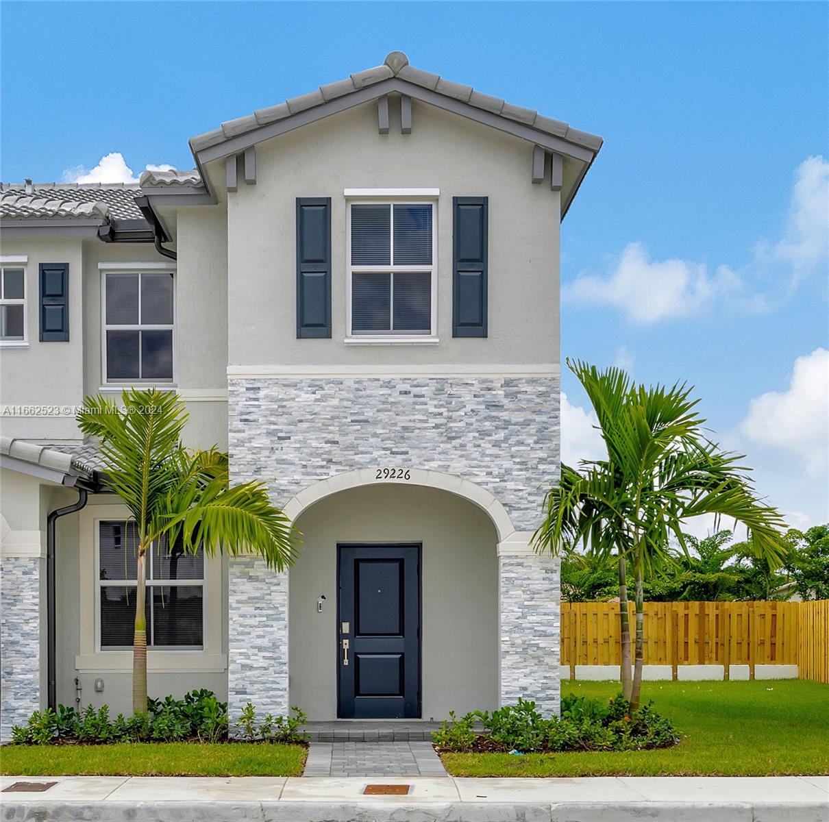 a front view of a house with a yard