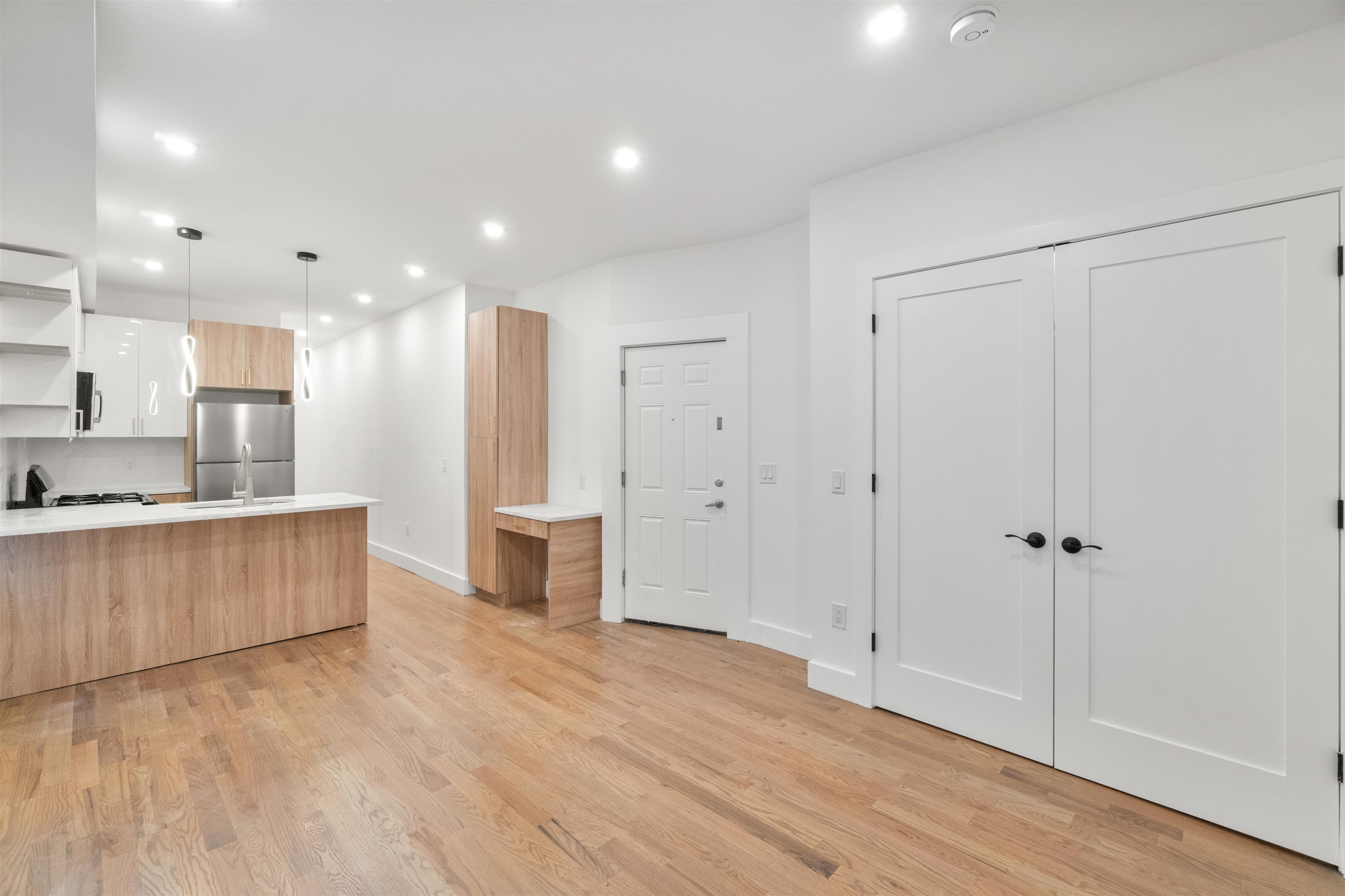 a view of kitchen with wooden floor