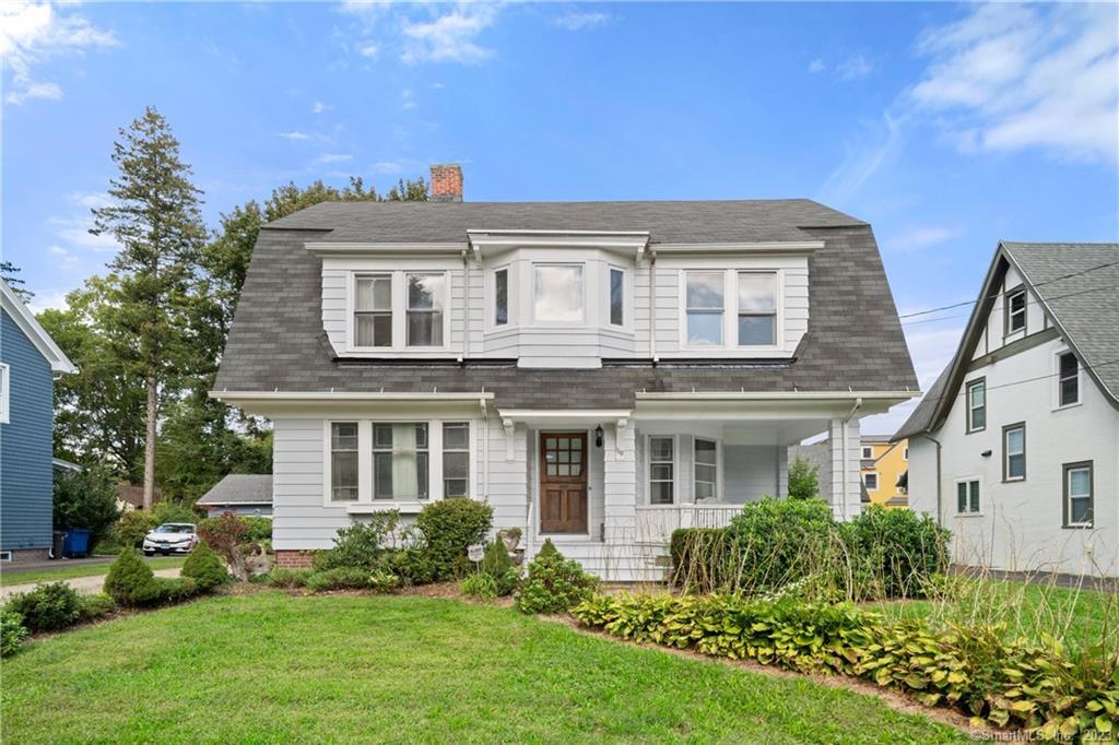 front view of a house with a yard