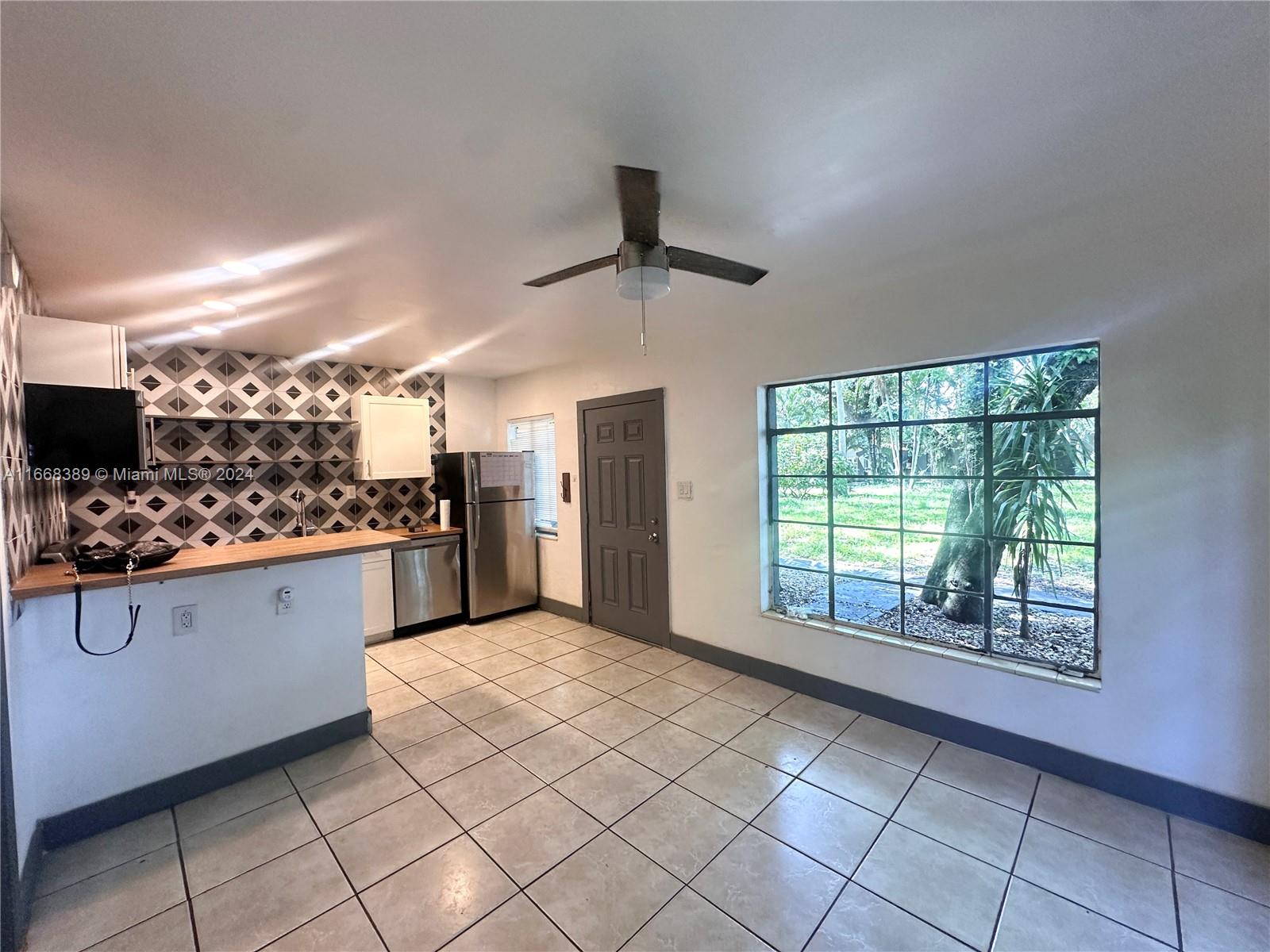 a kitchen with stainless steel appliances granite countertop a stove and a sink