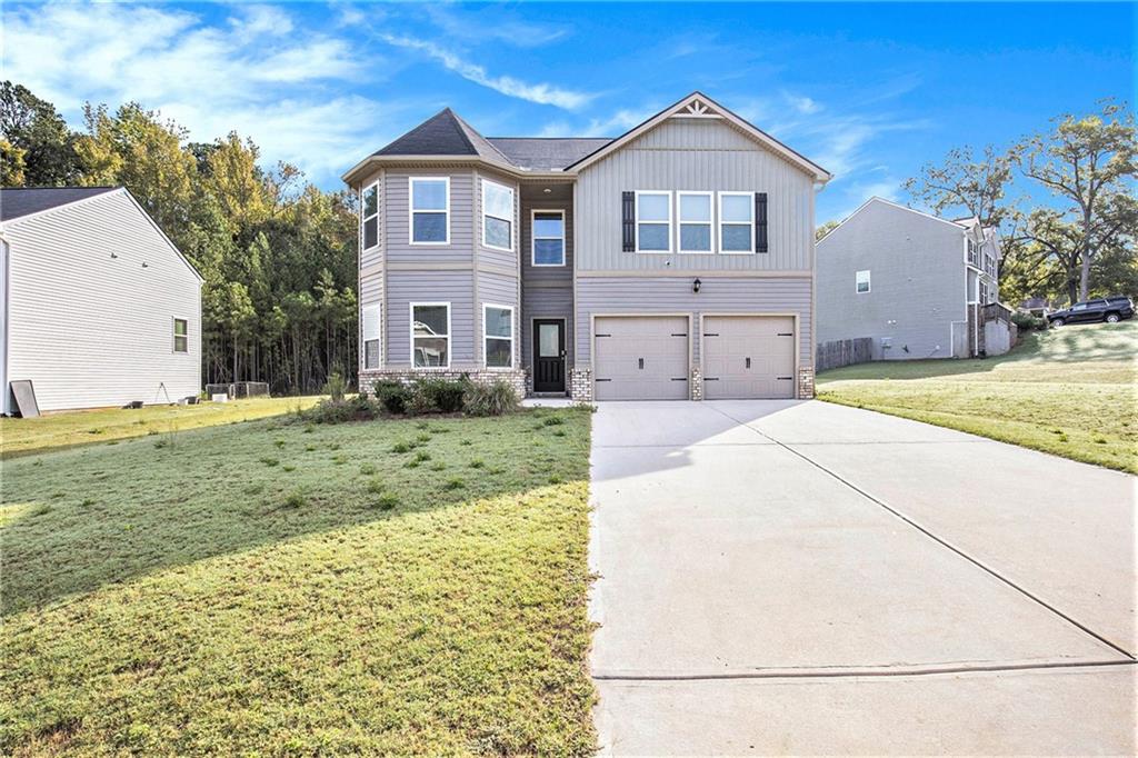 a front view of a house with a yard