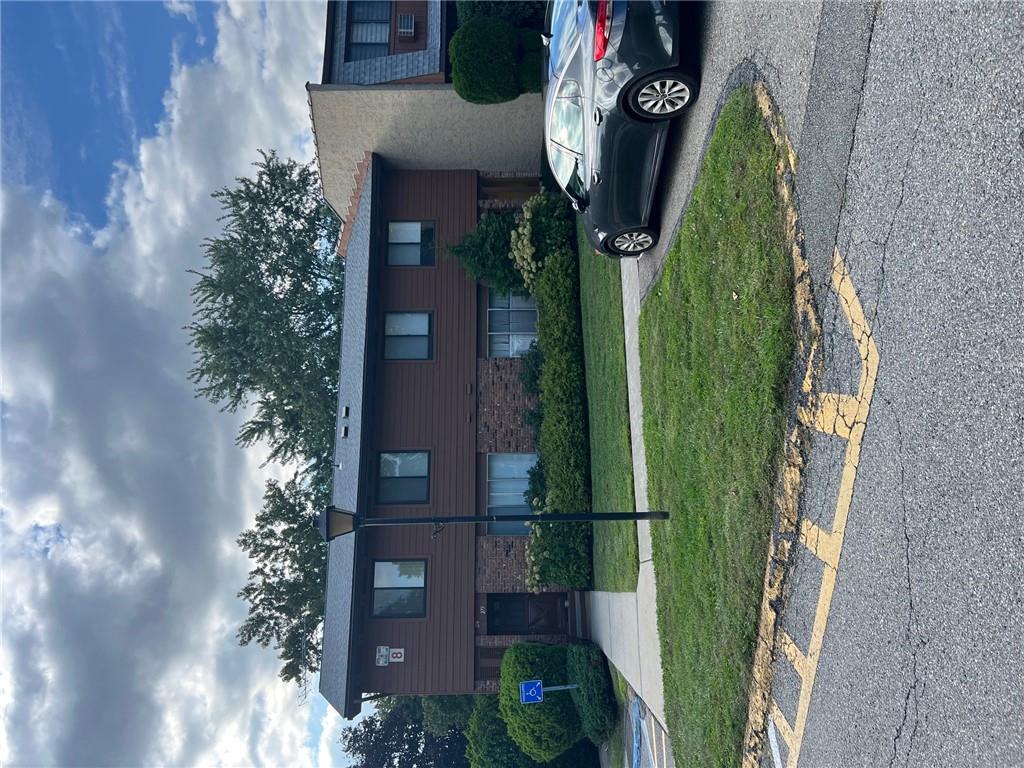 a car parked in front of a house