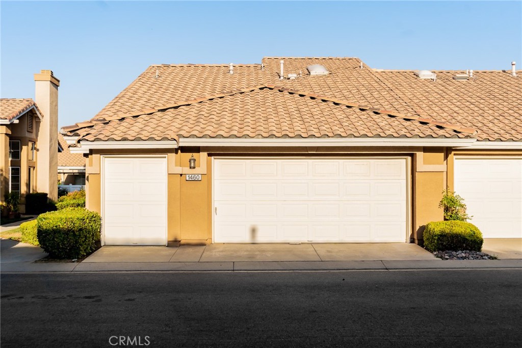 a front view of a house with a garage