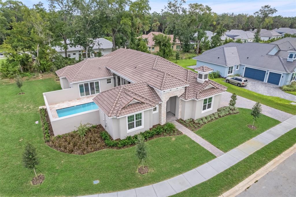 a aerial view of a house with a yard