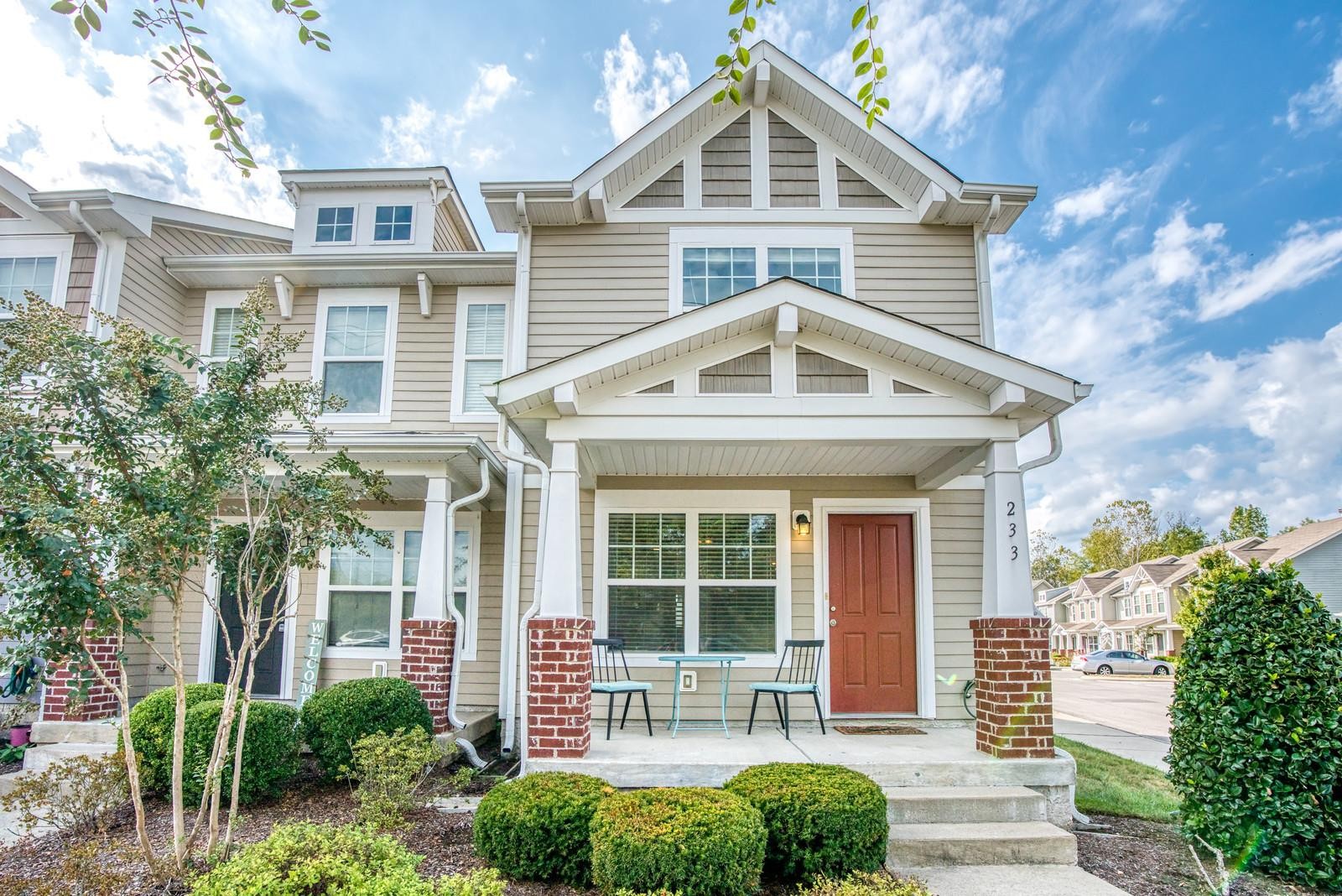 a front view of a house with a yard