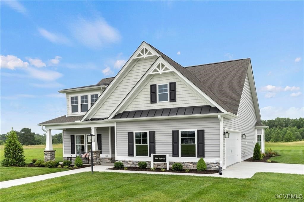 Craftsman house featuring a porch, a garage, and a