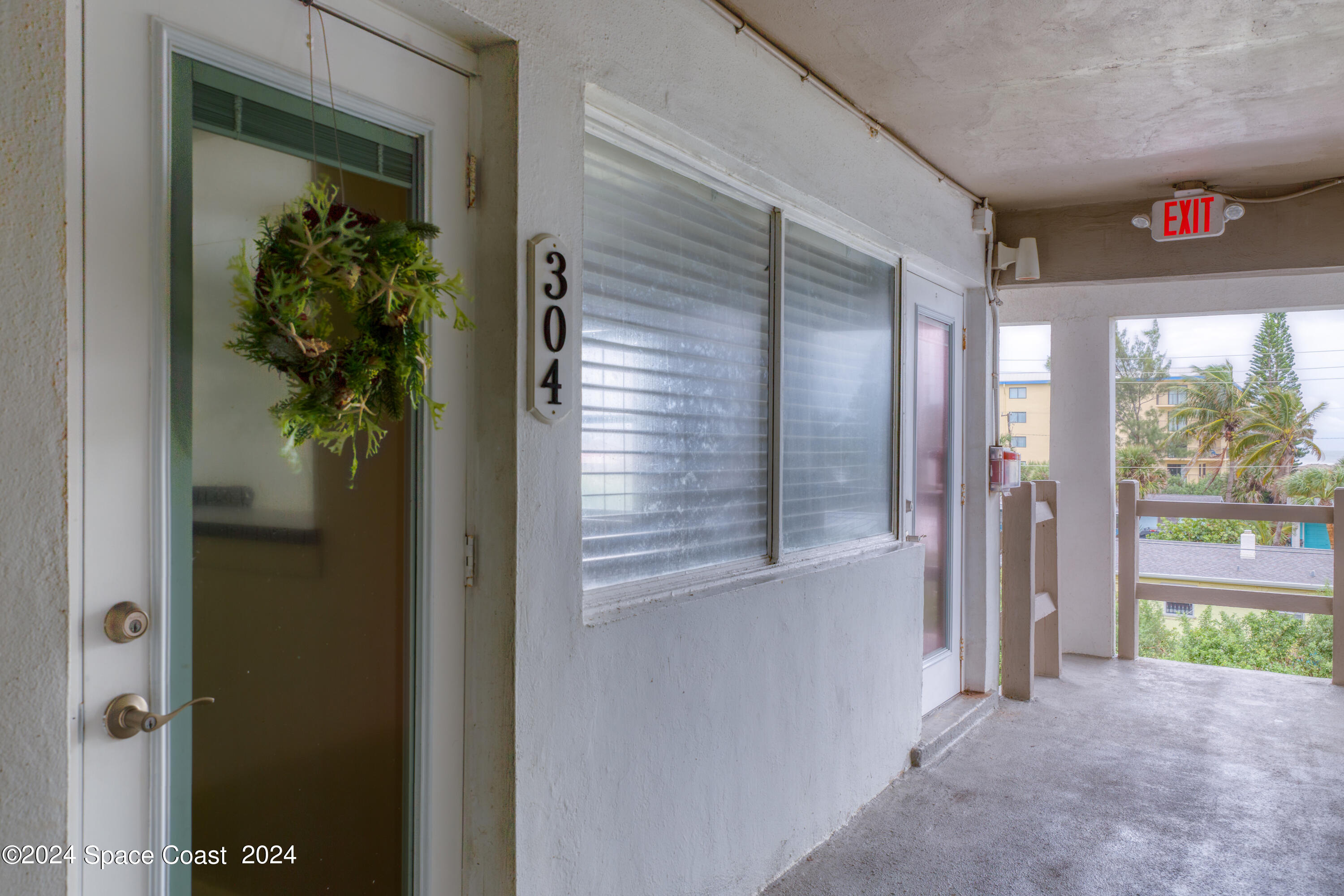 a view of a hallway of the house and front door