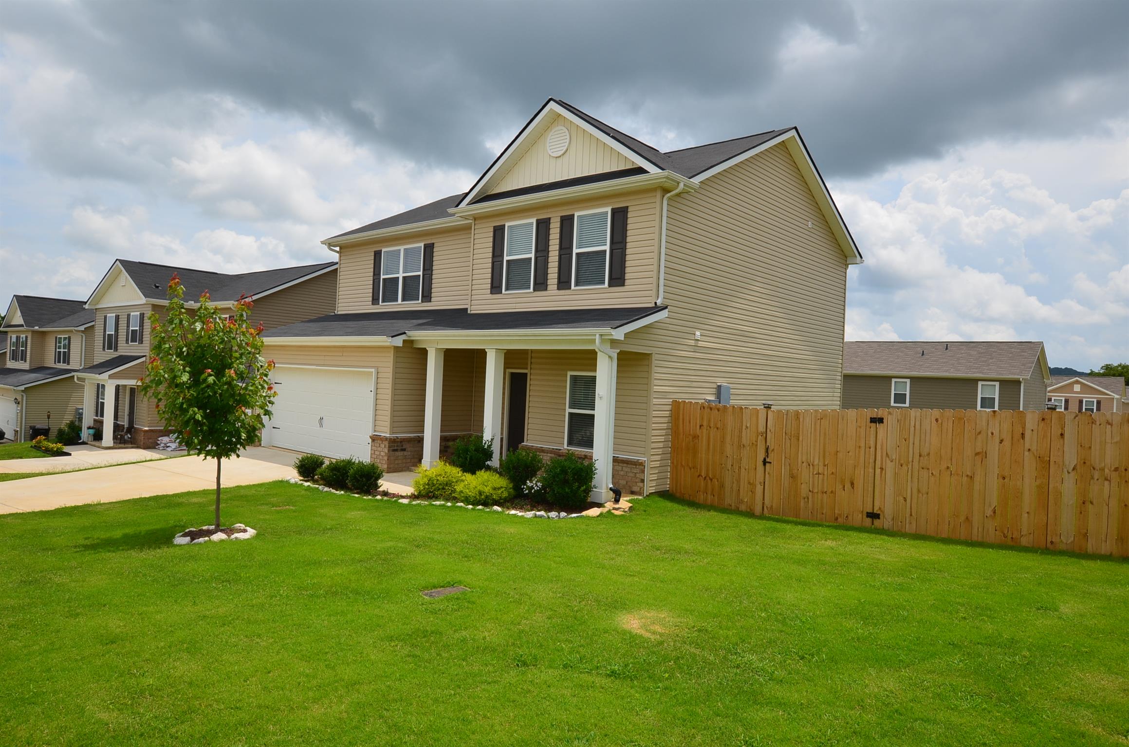 front view of a house with a yard