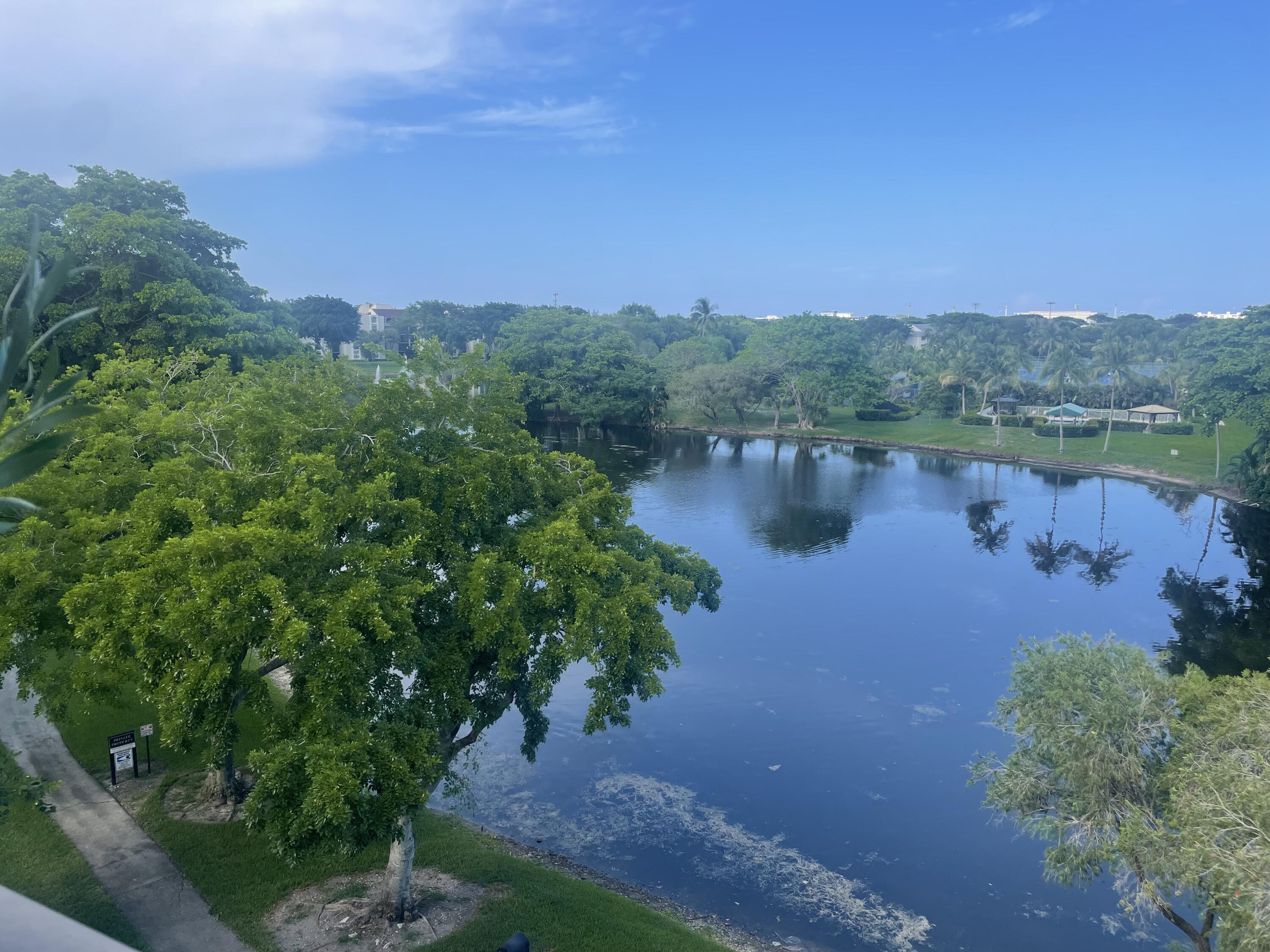 a view of a lake with houses in the back