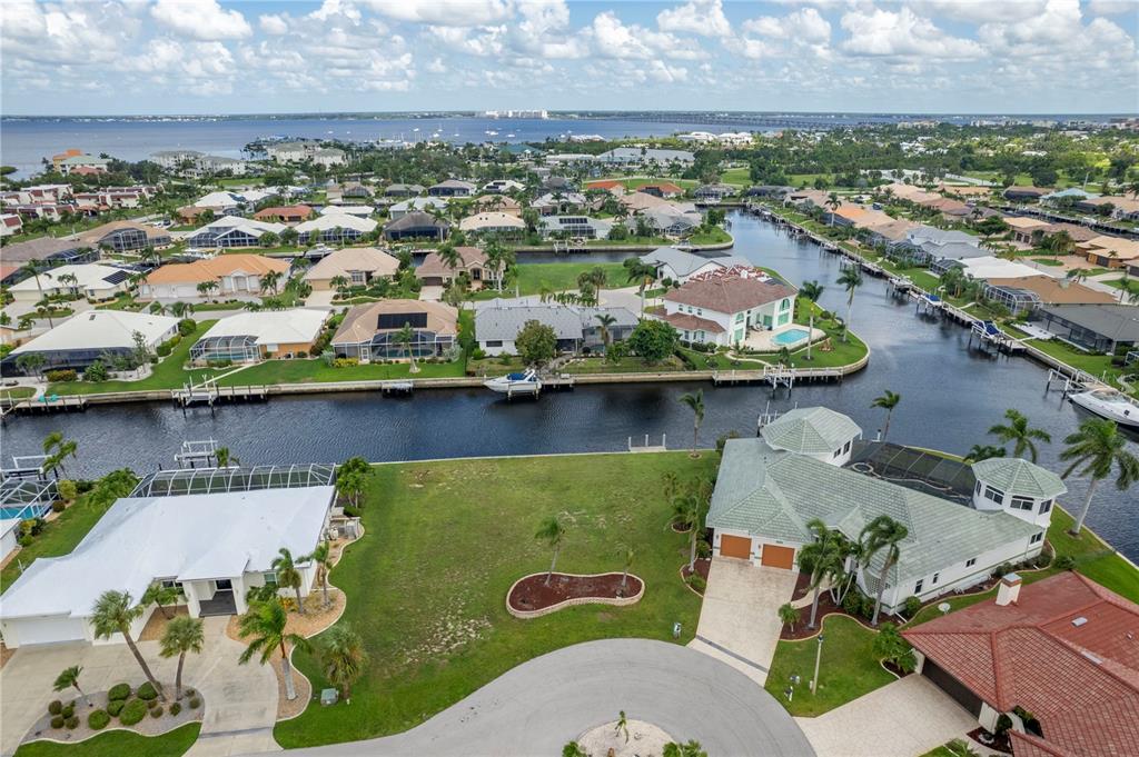 an aerial view of a house with a swimming pool outdoor seating and yard