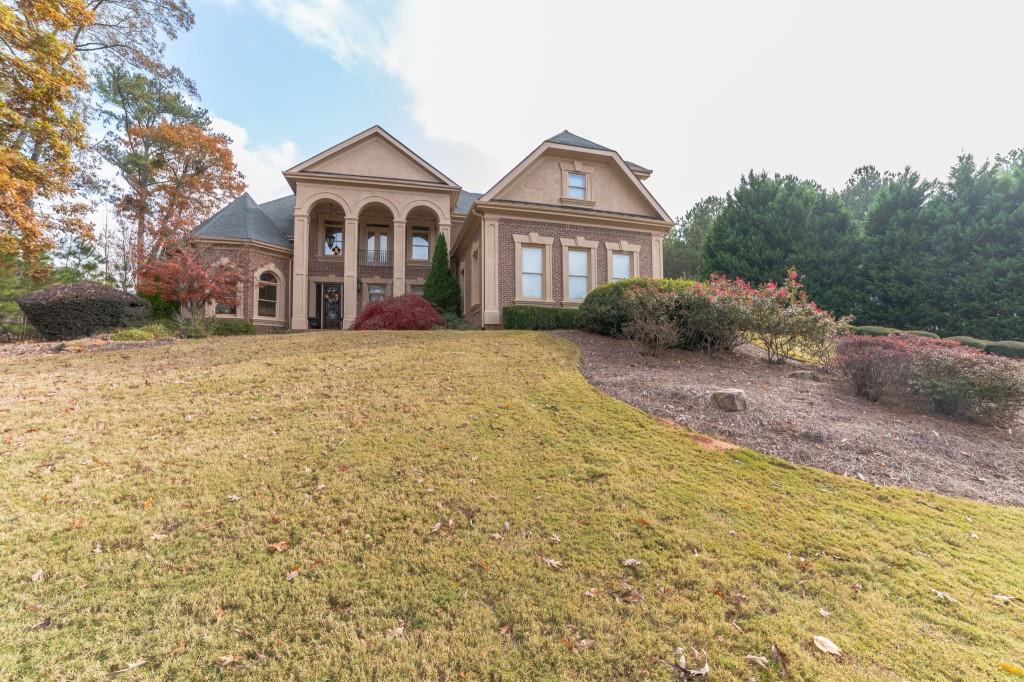 a front view of a house with a yard