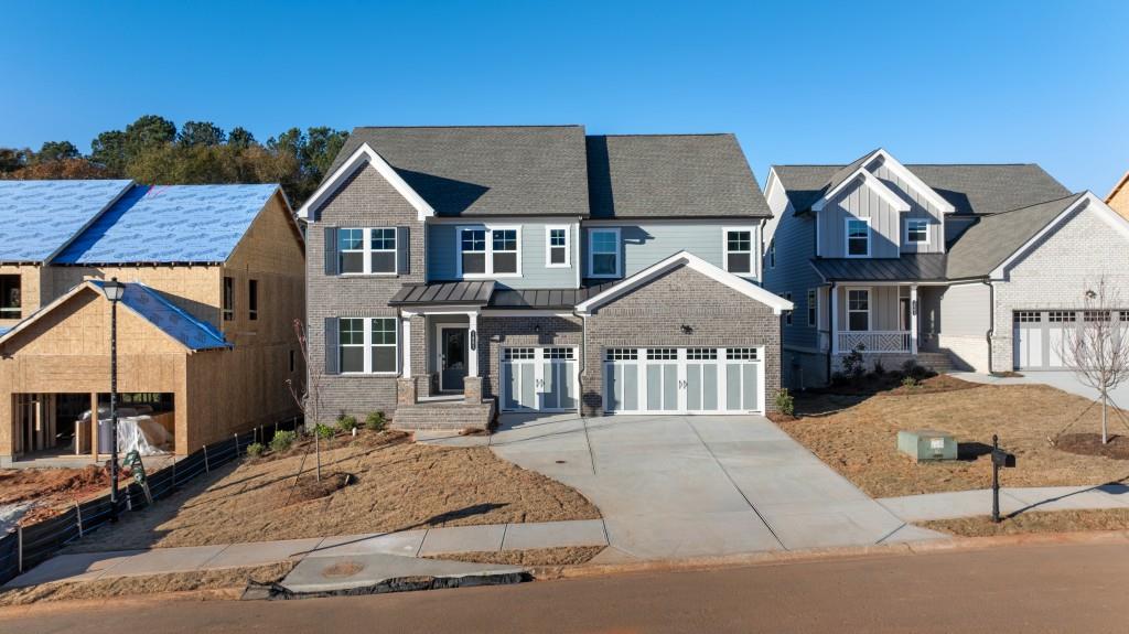 a front view of a house with yard