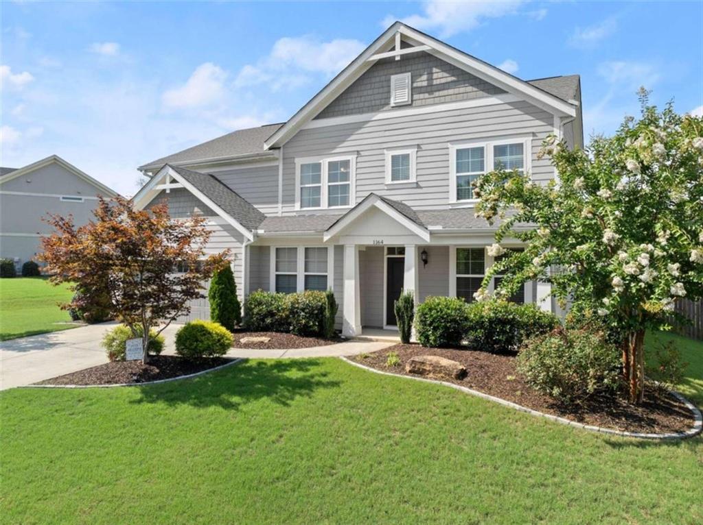 a front view of a house with a yard