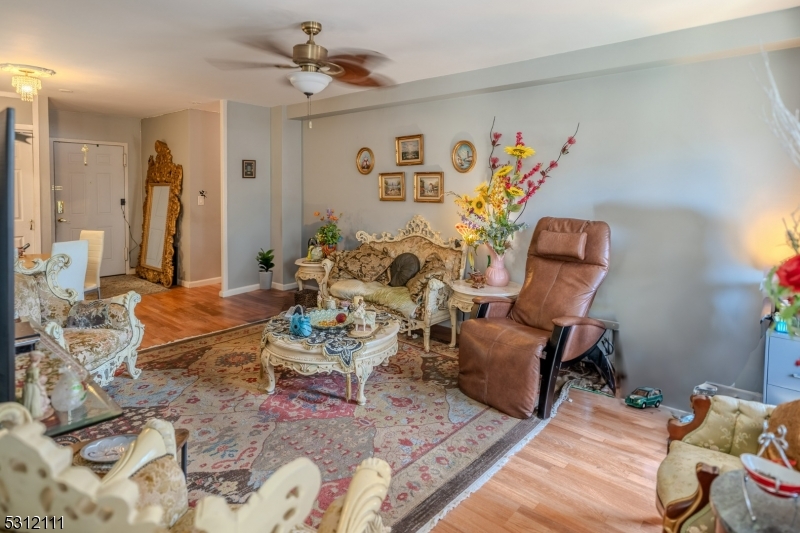 a living room with furniture flowerpot and a window