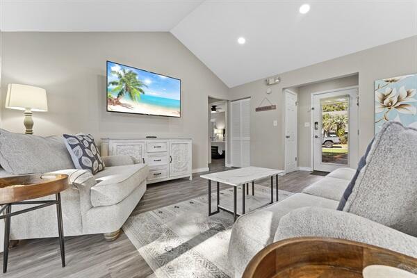 a living room with furniture and a flat screen tv