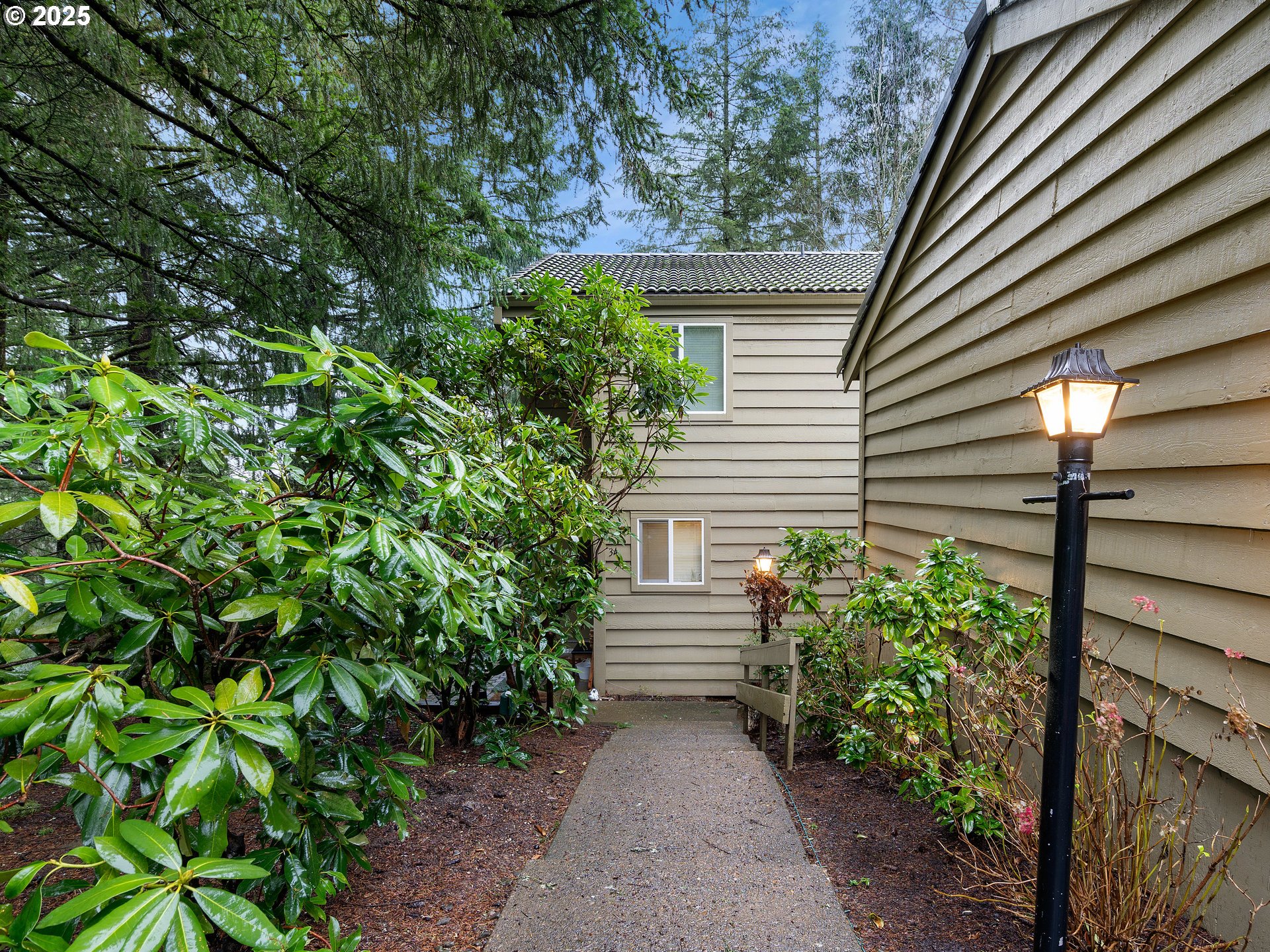 a view of house with backyard and garden