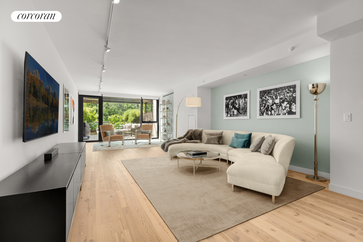 a living room with furniture and a flat screen tv