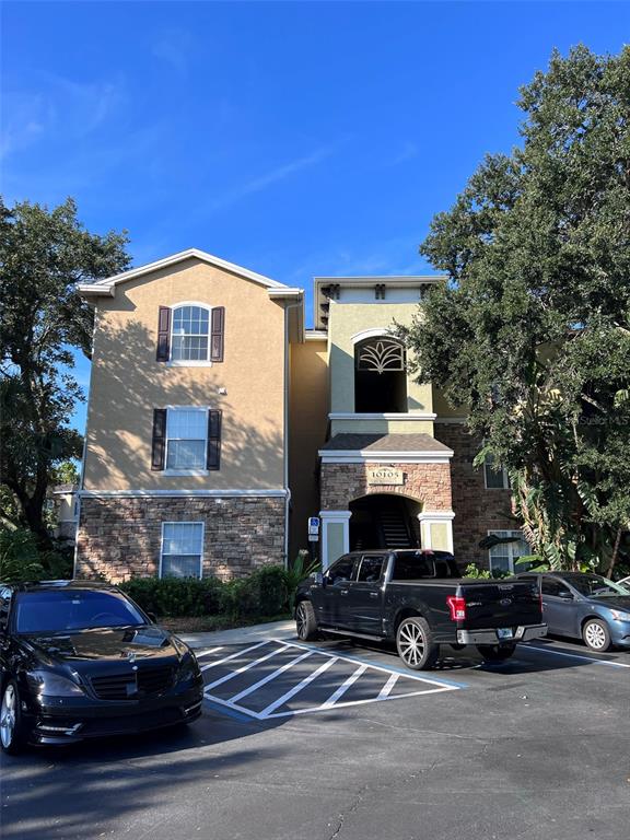 a front view of a house with parking space