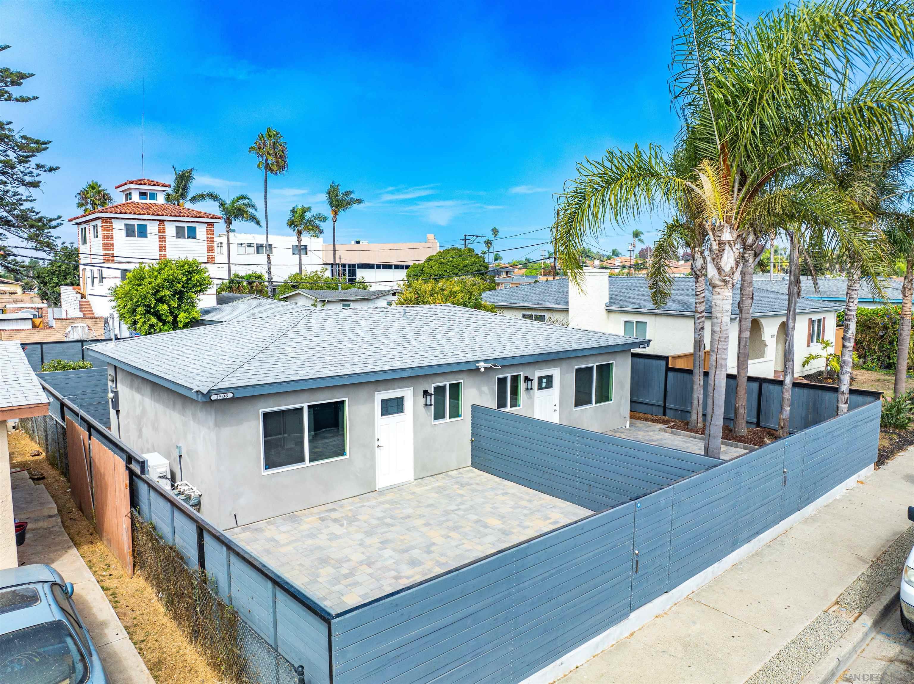 a aerial view of a house with palm trees