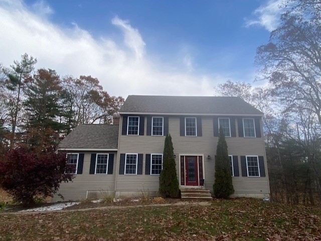 front view of a house with a yard