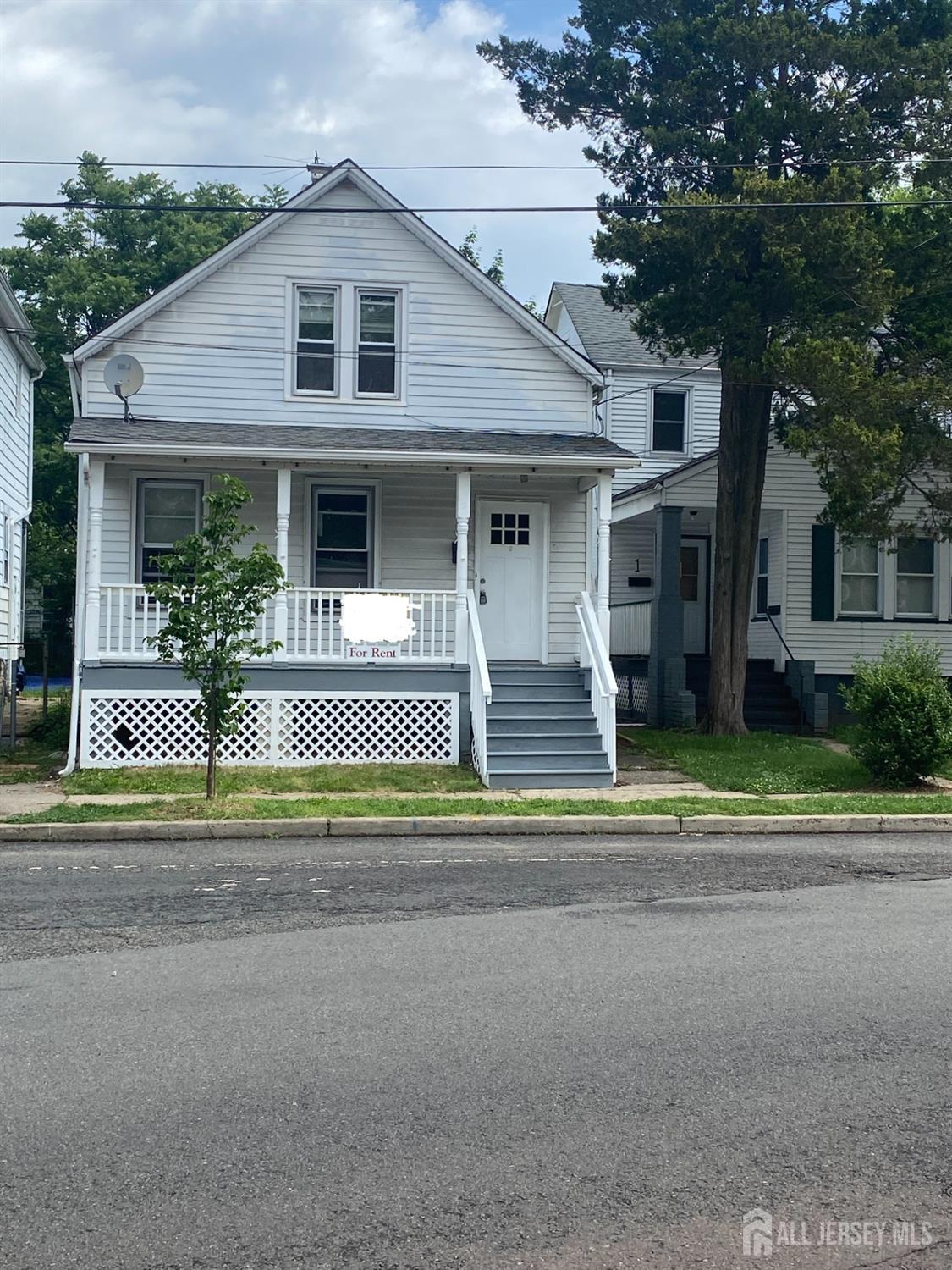 front view of a house with a small yard