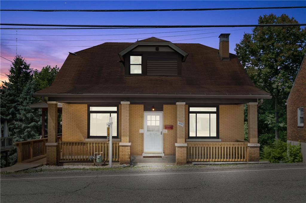 a front view of a house with a garage