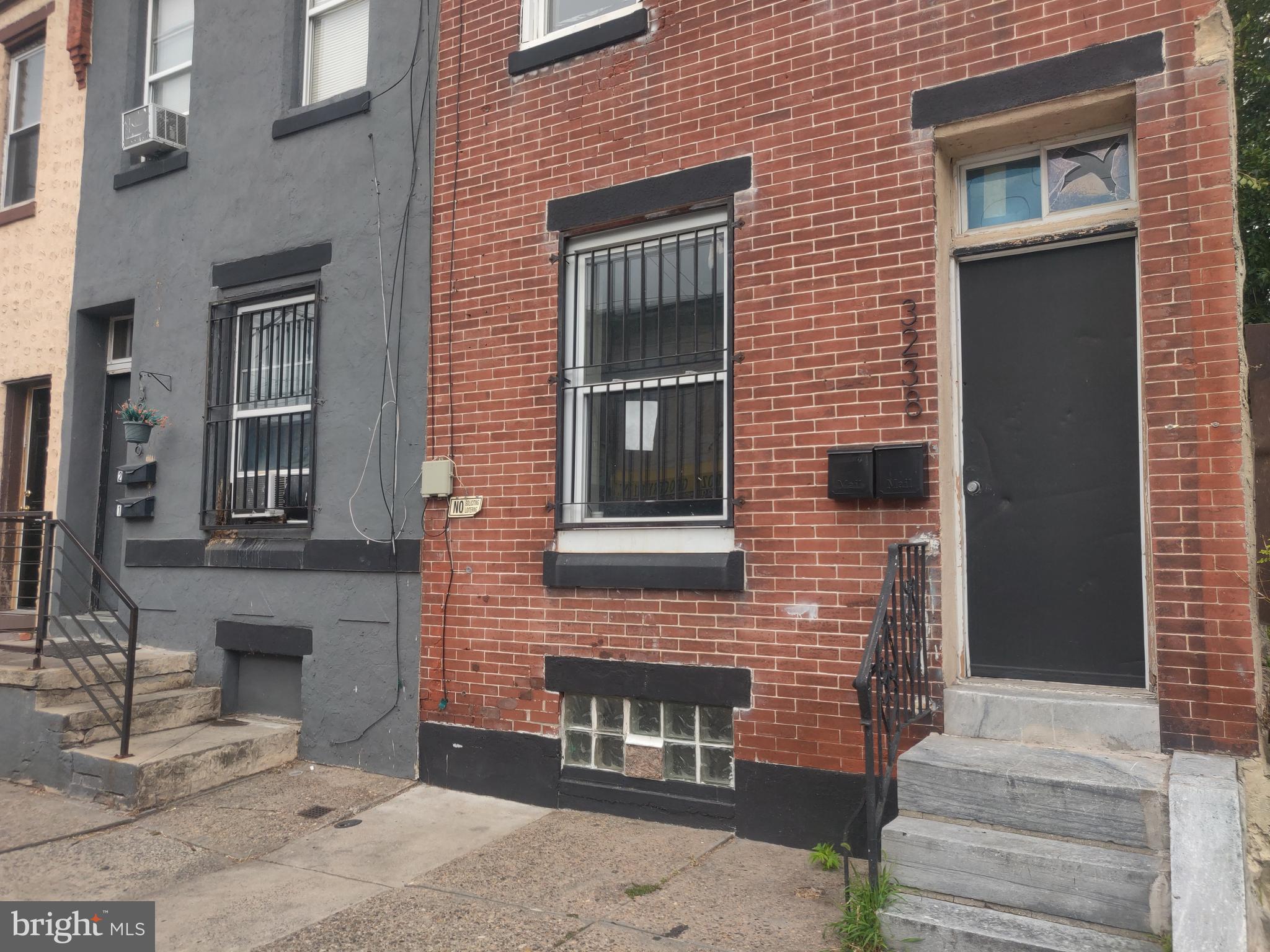 a brick house with a large windows