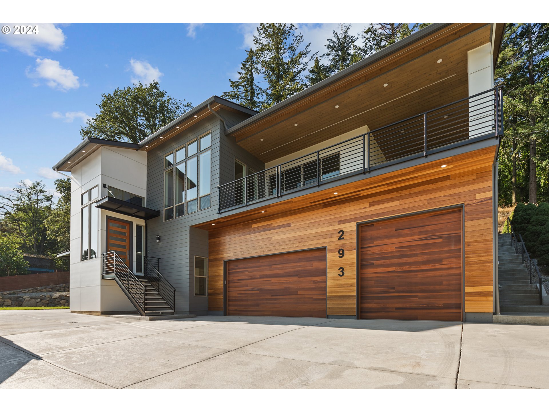 a side view of a house with a garage