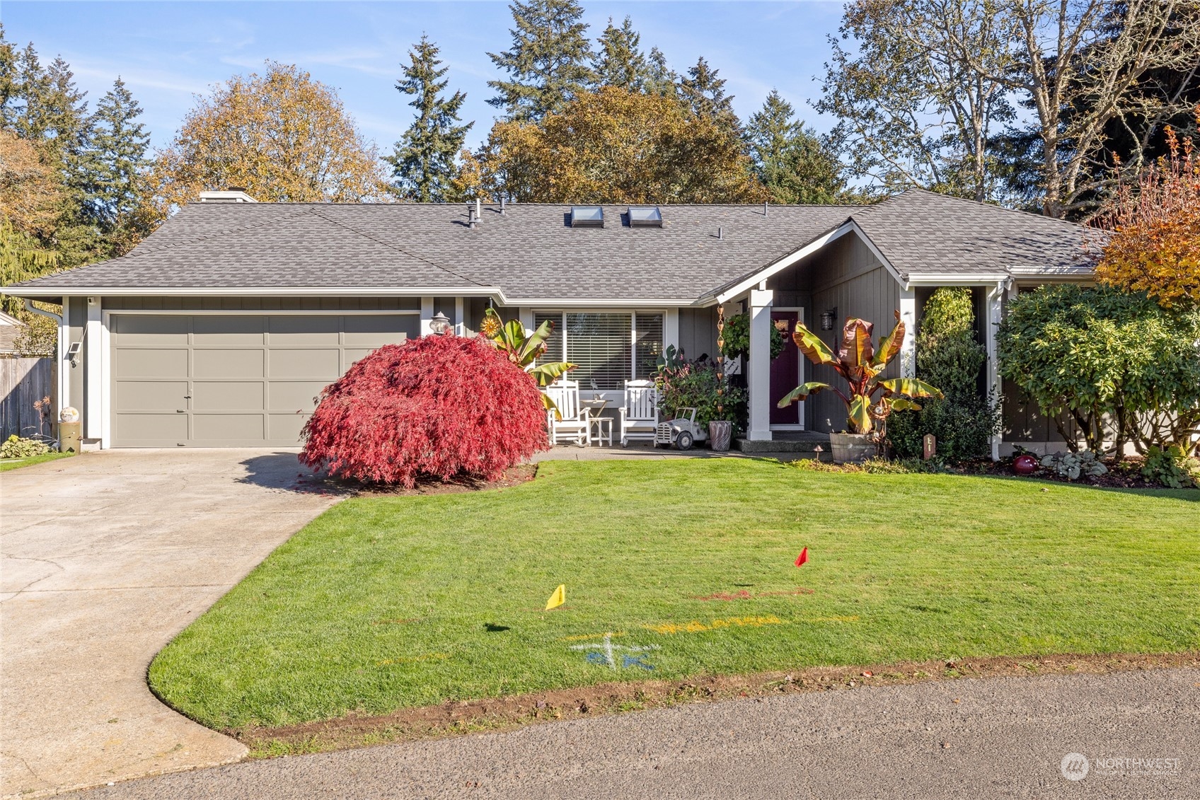 a front view of a house with garden