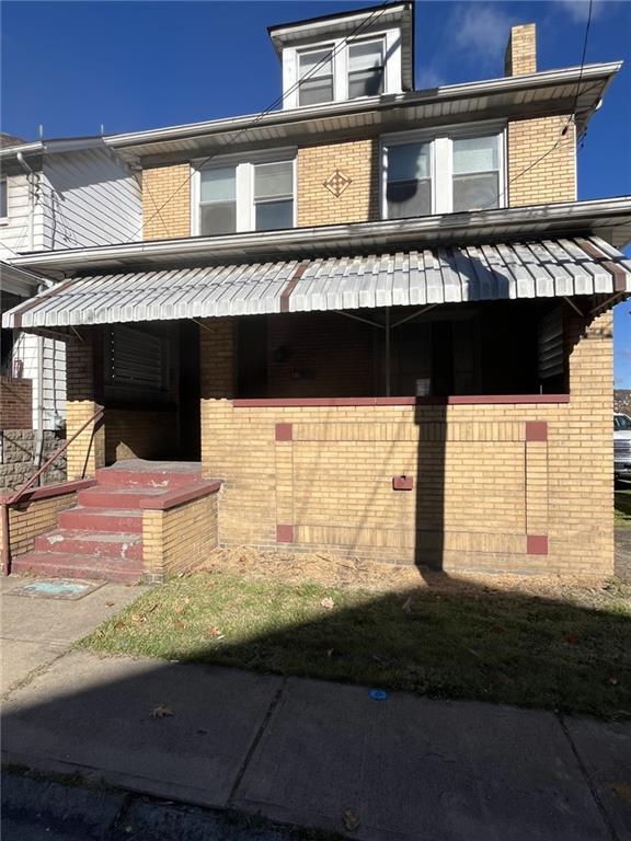 a view of a balcony and front door