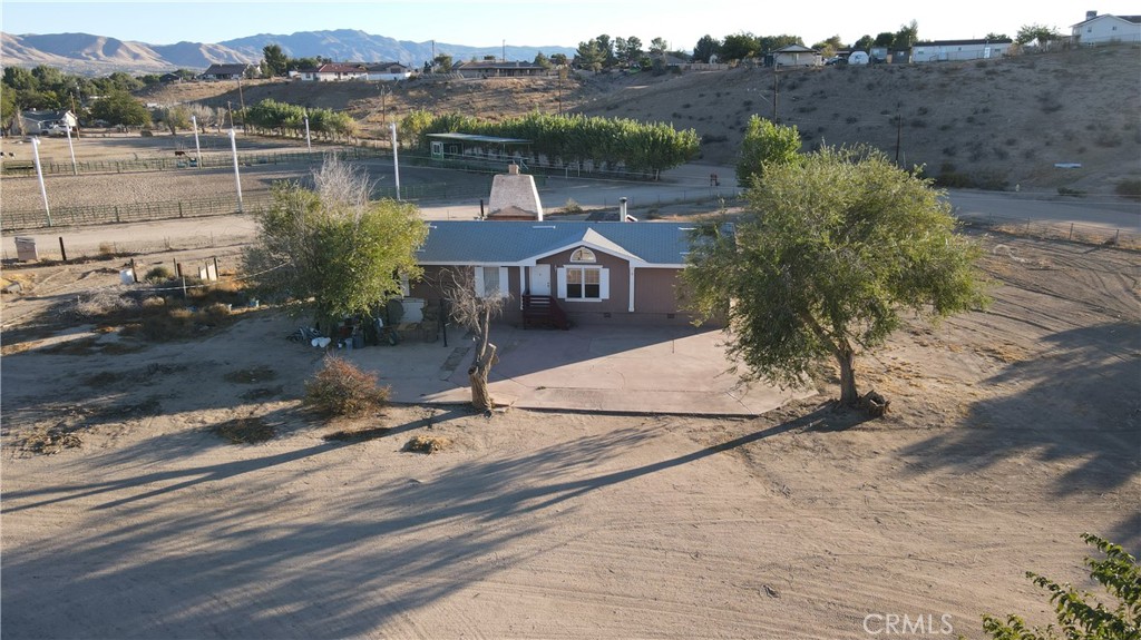 an aerial view of house with yard