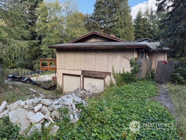 a house with trees in the background