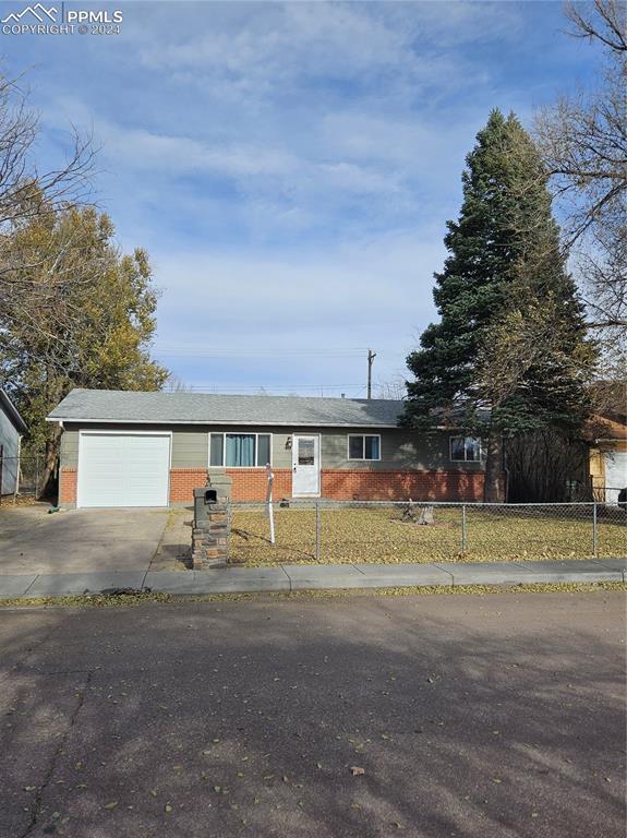 Single story home featuring a garage